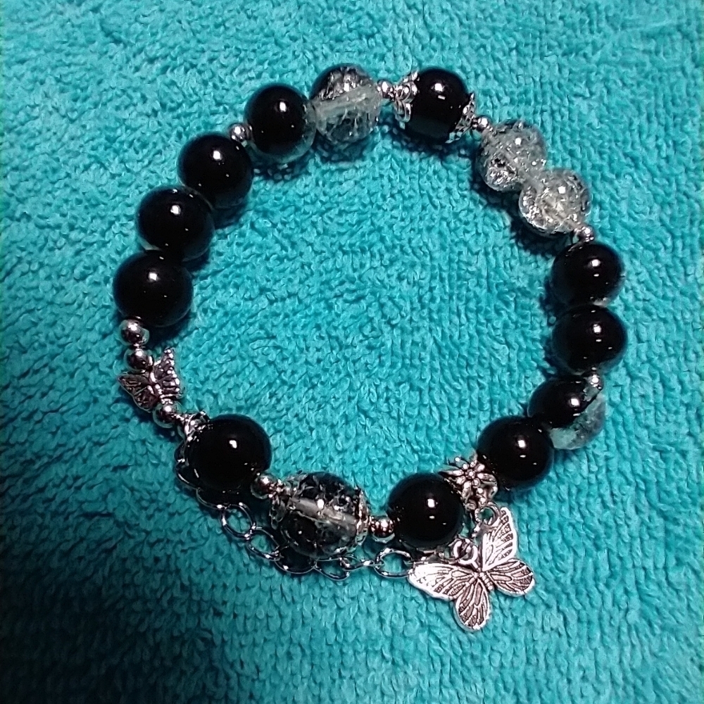 Silvertone black cracked glass butterfly stretch bracelet